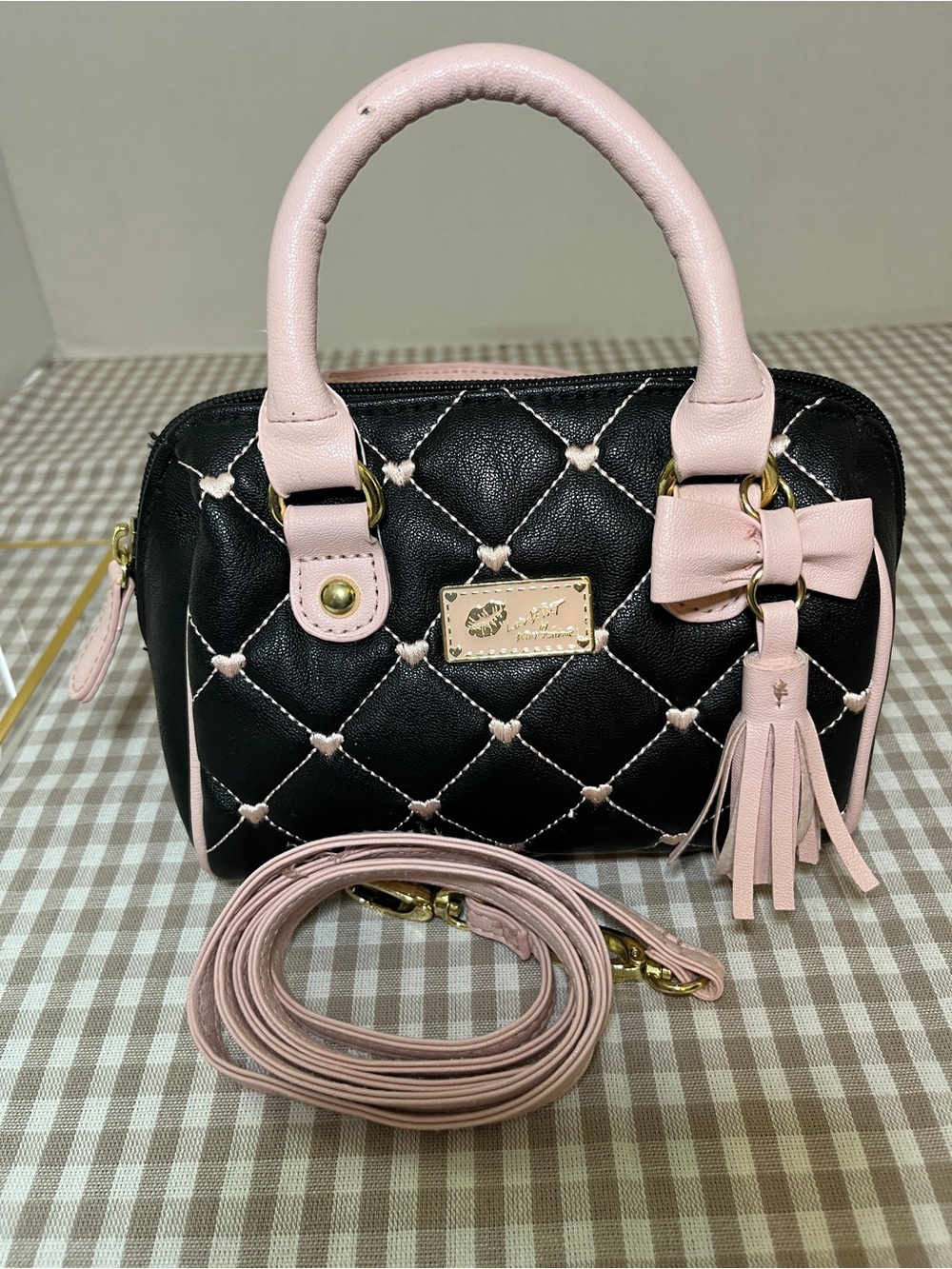 Betsey Johnson Harley quilted heart mini tote in black and pink.